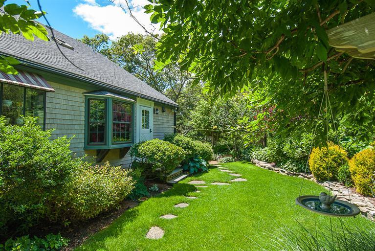 127 Point Hill Road West Barnstable, MA 02668 - Photo 29 of 29 a view of backyard with potted plants and large tree