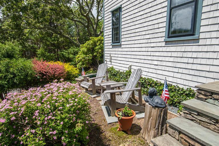 127 Point Hill Road West Barnstable, MA 02668 - Photo 5 of 29 a table and chairs in front of a house
