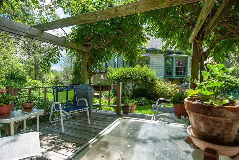127 Point Hill Road West Barnstable, MA 02668 - Photo 6 of 29 a view of a chair and tables in the patio