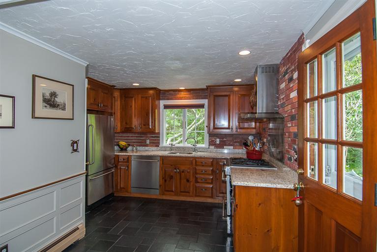 127 Point Hill Road West Barnstable, MA 02668 - Photo 10 of 29 a kitchen with stainless steel appliances granite countertop a stove a sink dishwasher and a refrigerator