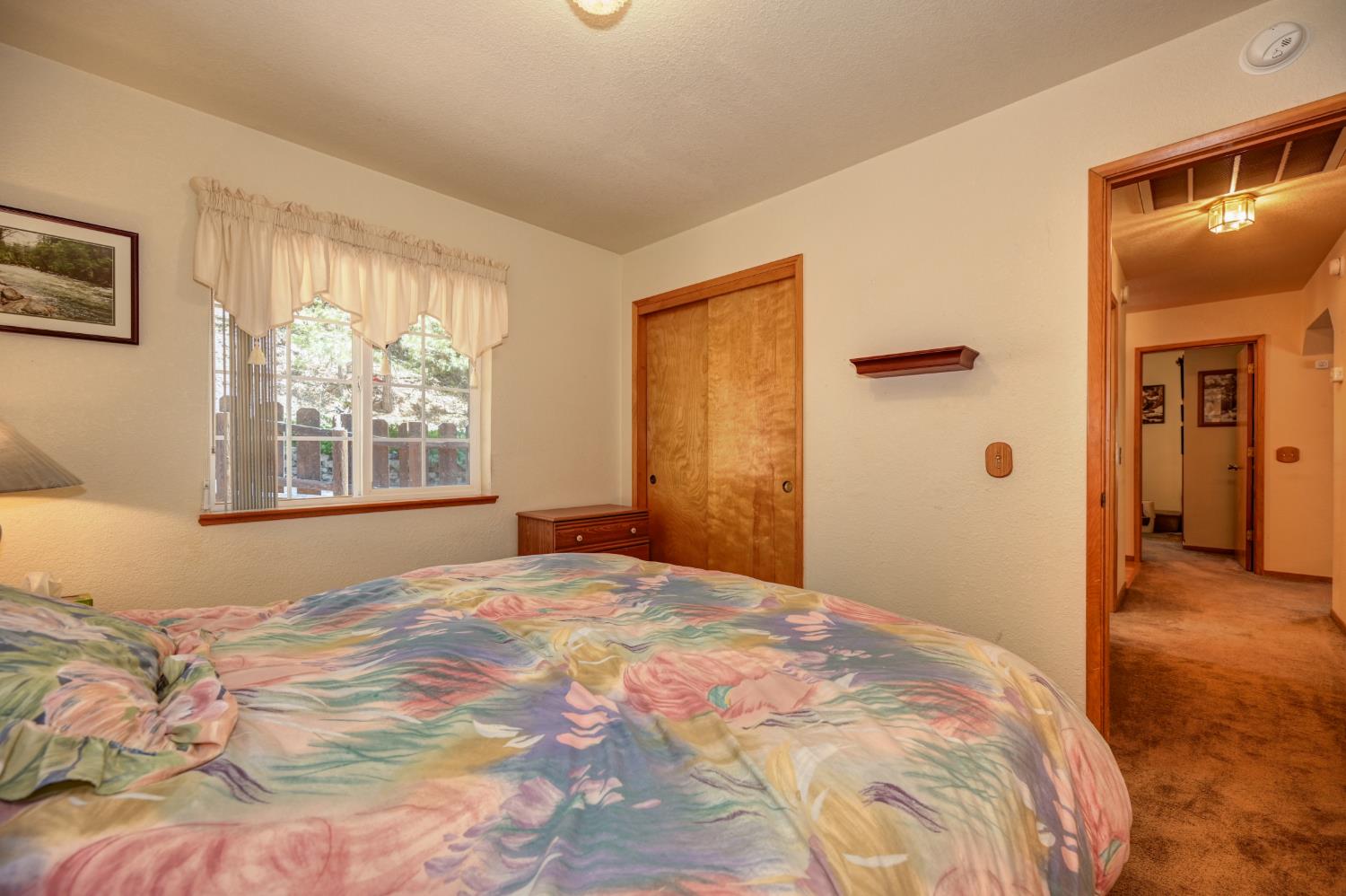 23998 Stable Road Sonora, CA 95370 - Photo 20 of 41 a bedroom with a bed and a window