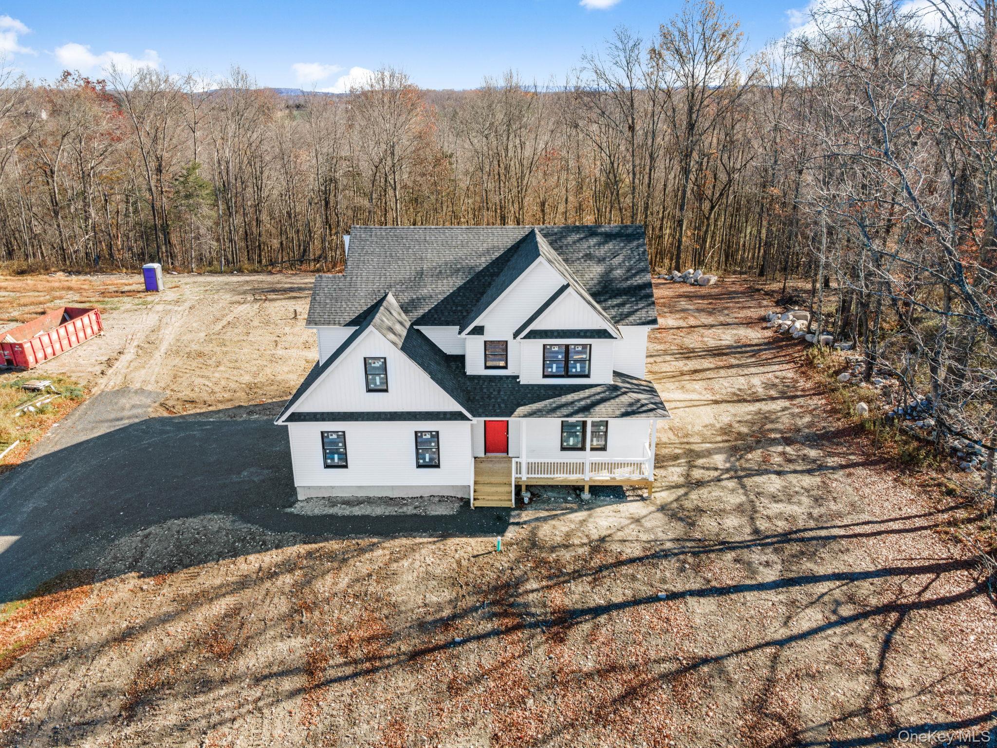 13 Harrier Ridge Drive Wallkill, NY 12589 - Photo 35 of 40 View of front of property featuring roof with shingles and a view of trees
