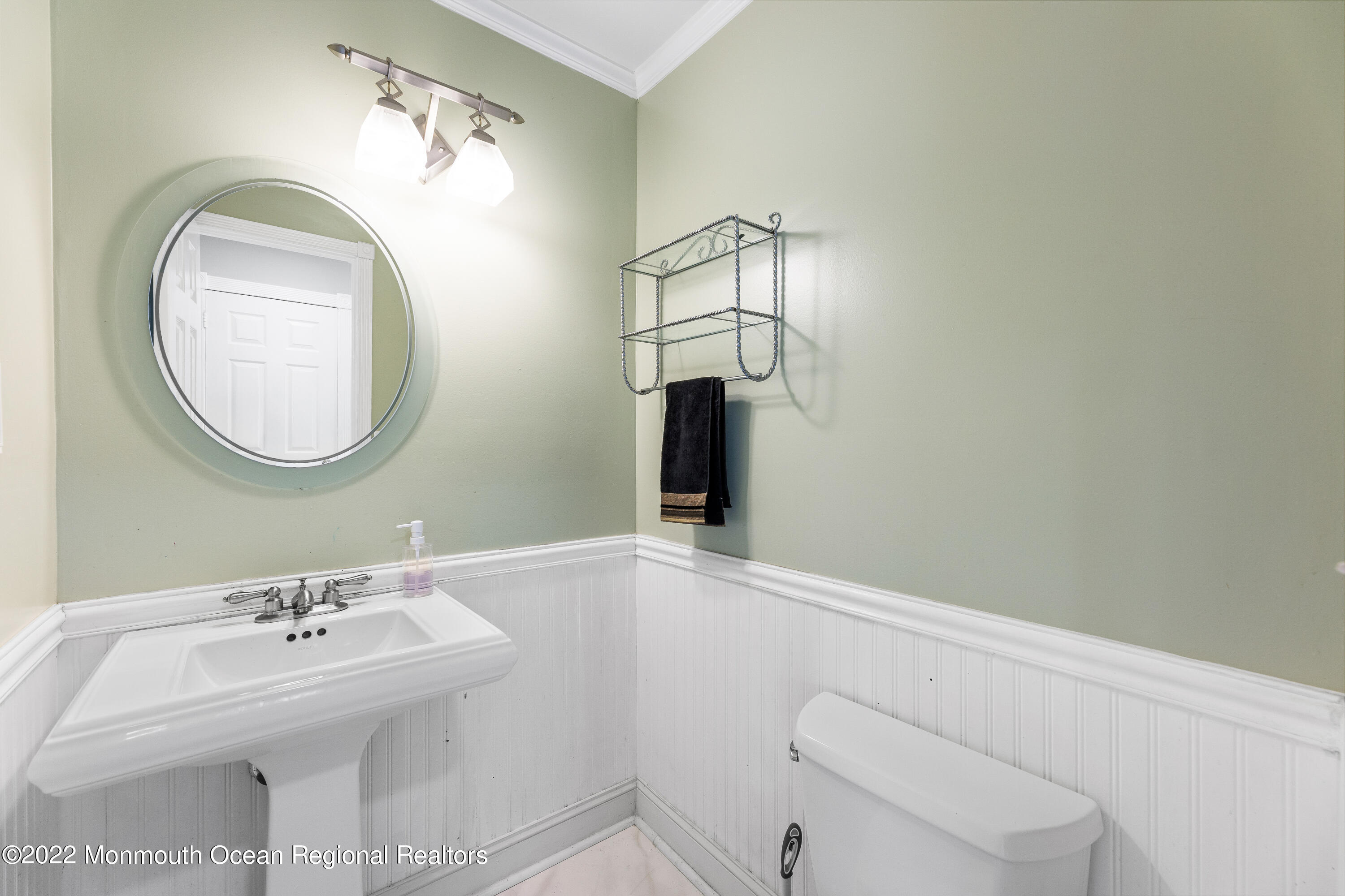 10 Reed Road Howell, NJ 07731 - Photo 20 of 32 a bathroom with a sink a toilet and a mirror
