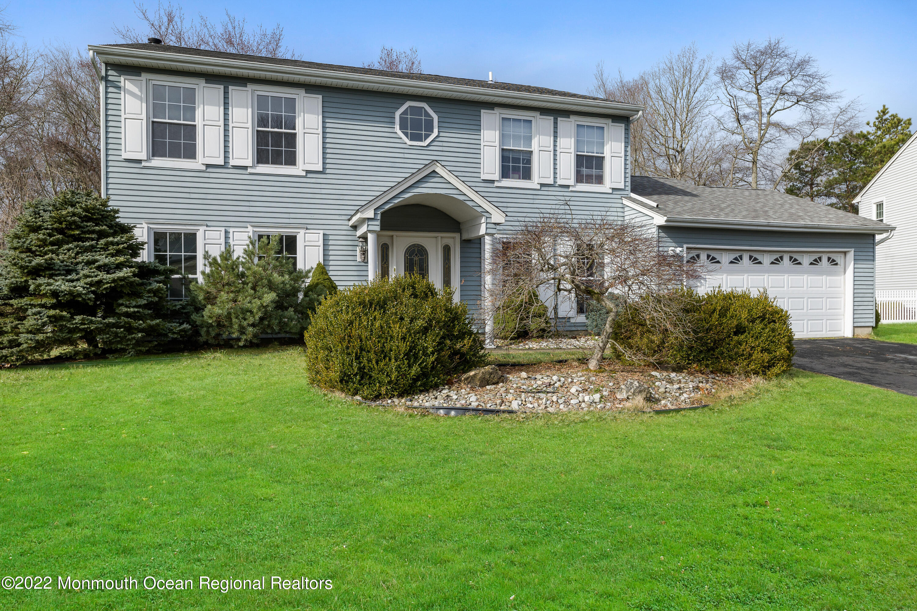 10 Reed Road Howell, NJ 07731 - Photo 2 of 32 a front view of a house with a garden
