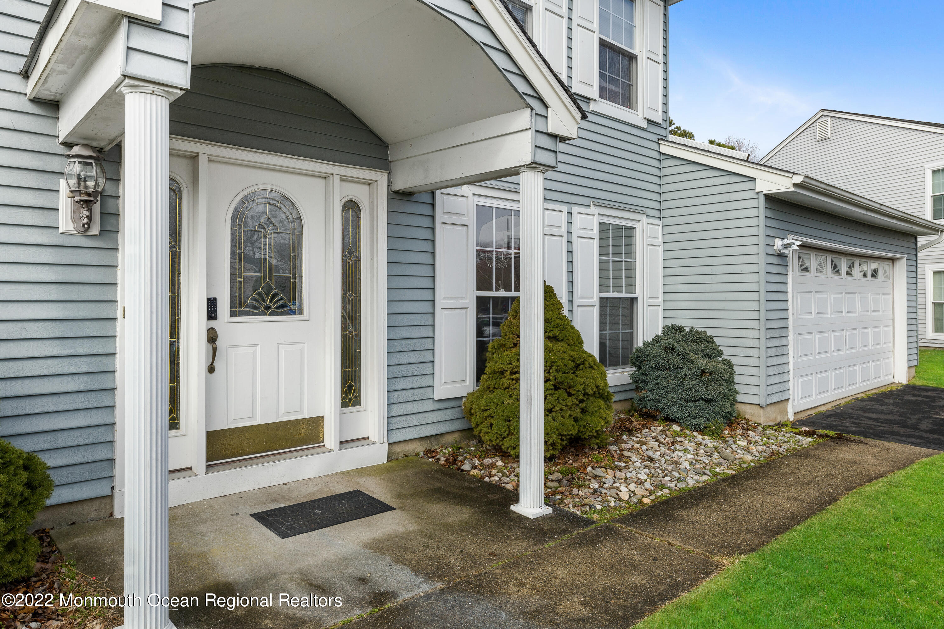 10 Reed Road Howell, NJ 07731 - Photo 4 of 32 a view of a house with small yard plants and wooden fence