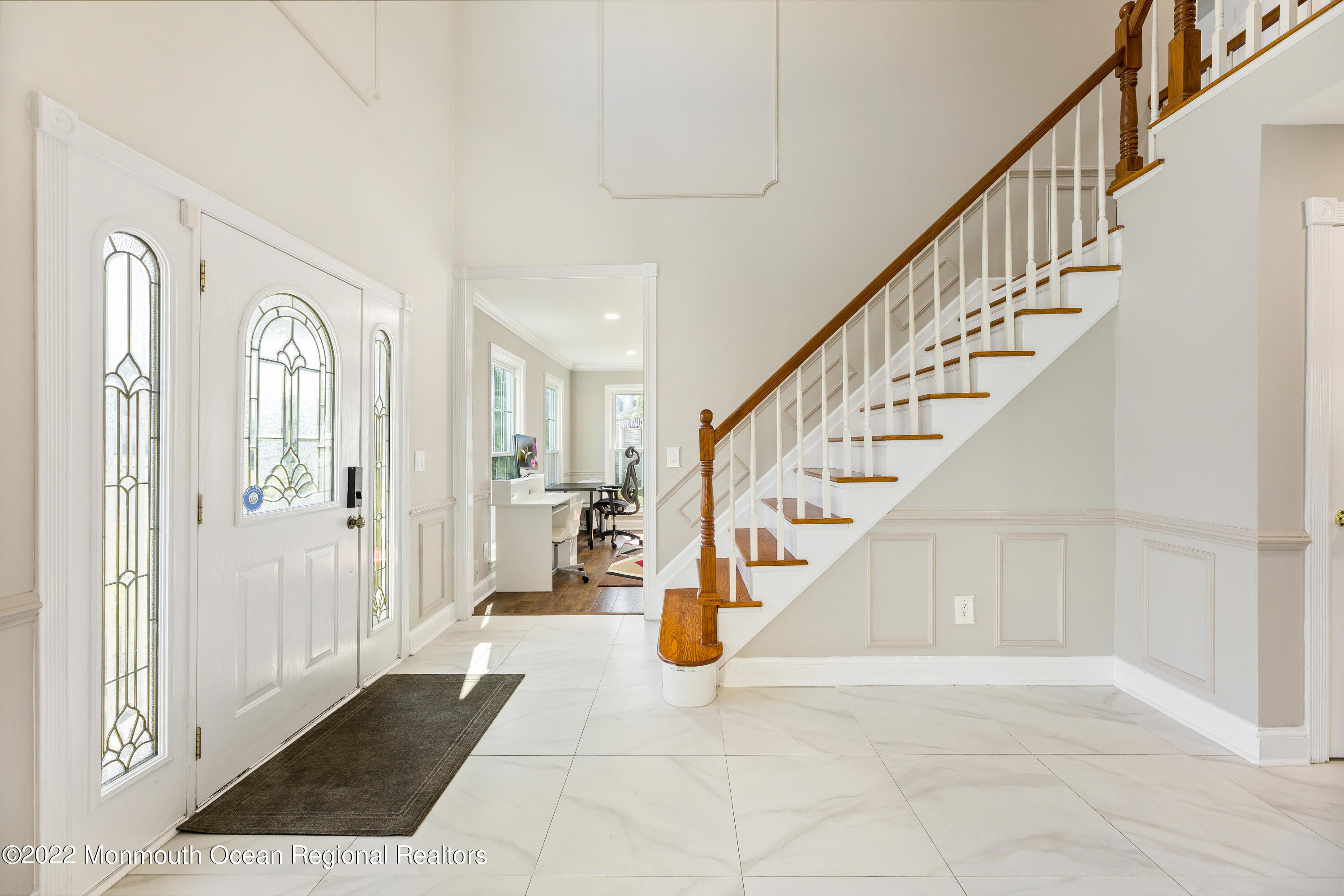 10 Reed Road Howell, NJ 07731 - Photo 6 of 32 a view of an entryway with wooden floor and a living room