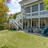 a view of a house with pool and sitting area