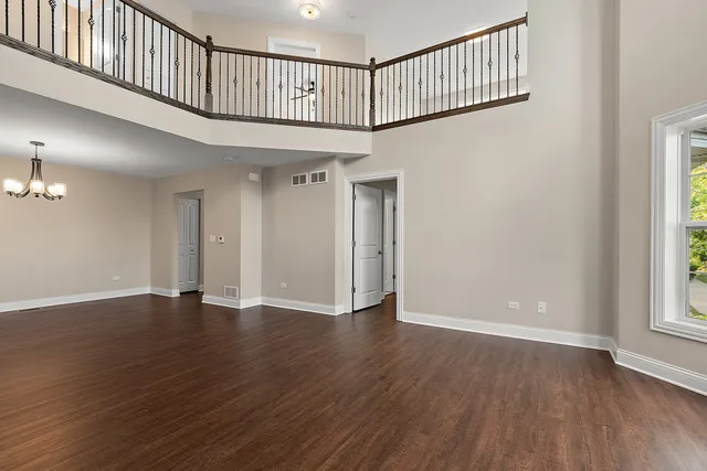 a view of an entryway with wooden floor