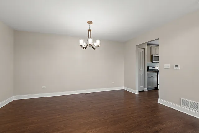 a kitchen with stainless steel appliances a sink cabinets and a stove top oven