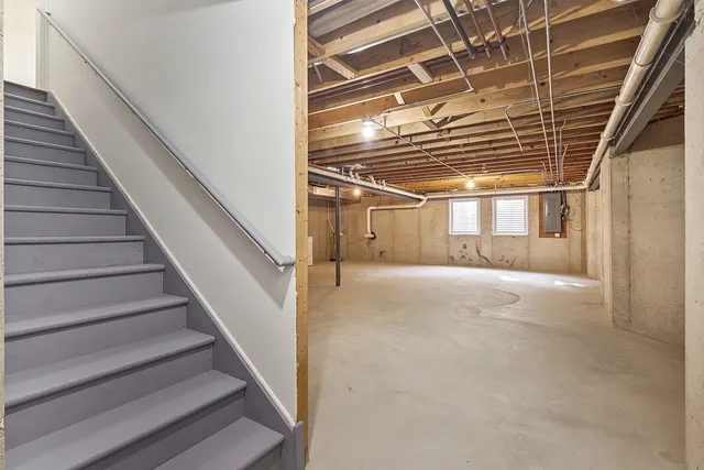a view of empty room with white walls and entryway