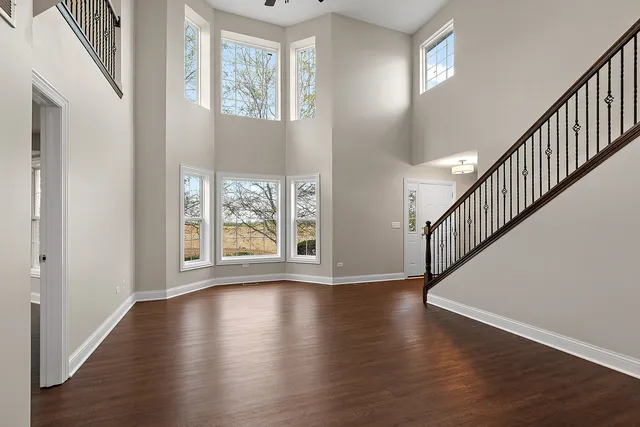 a view of an entryway with wooden floor