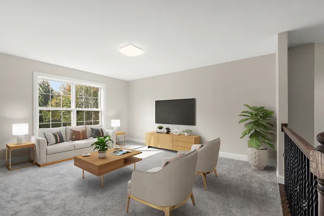 a living room with furniture a large window and a flat screen tv