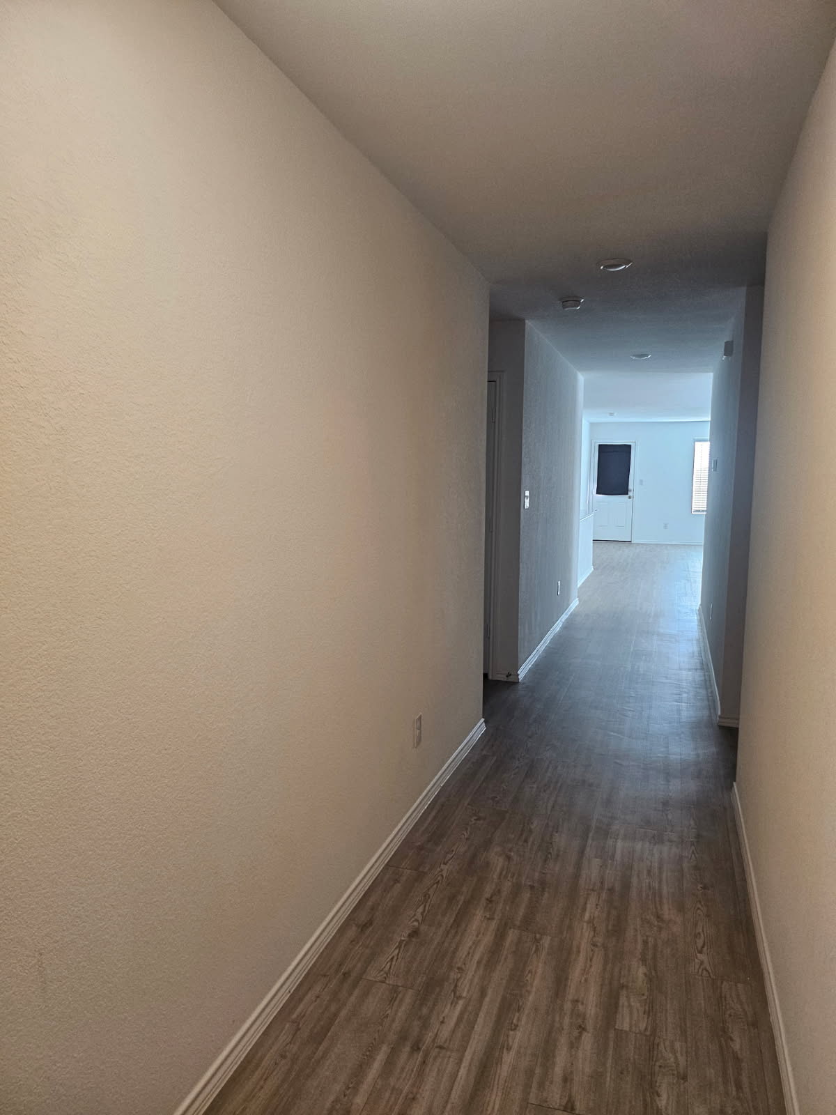2218 Cumulus Court Lockhart, TX 78644 - Photo 5 of 35 a view of a room with wooden floor and a window