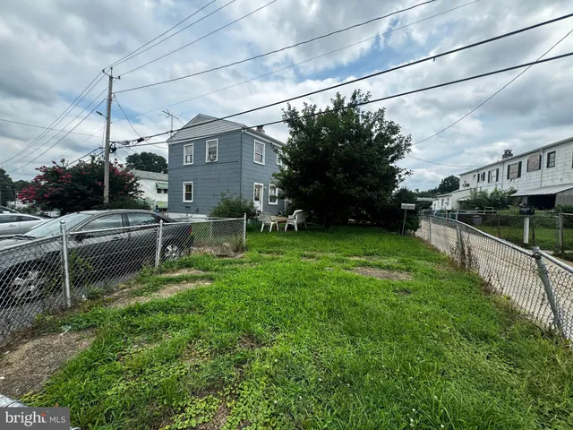a house view with a sitting space and garden