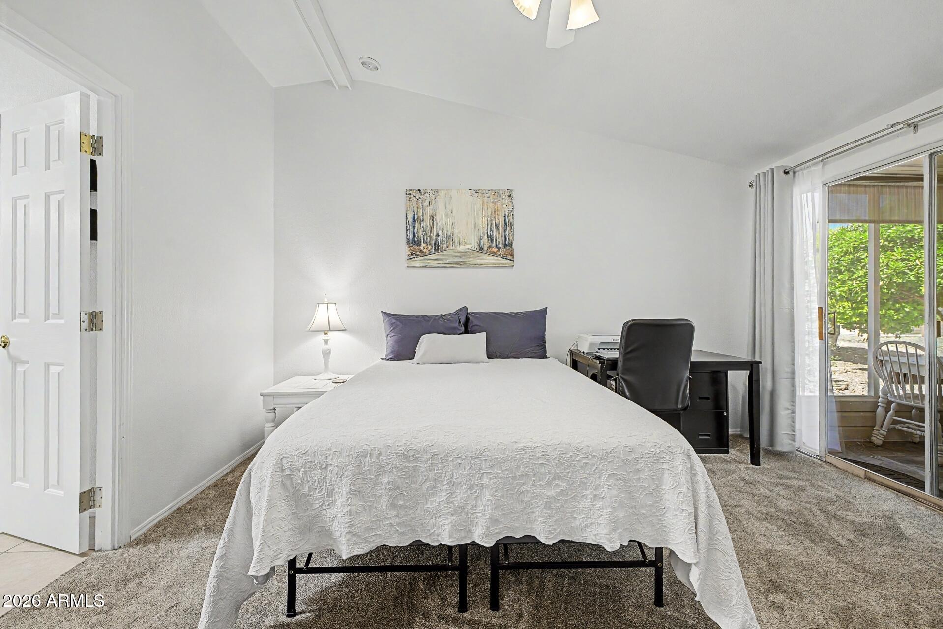 2550 South Ellsworth Road, Unit 46 Mesa, AZ 85209 - Photo 15 of 46 a bedroom with a bed and a table