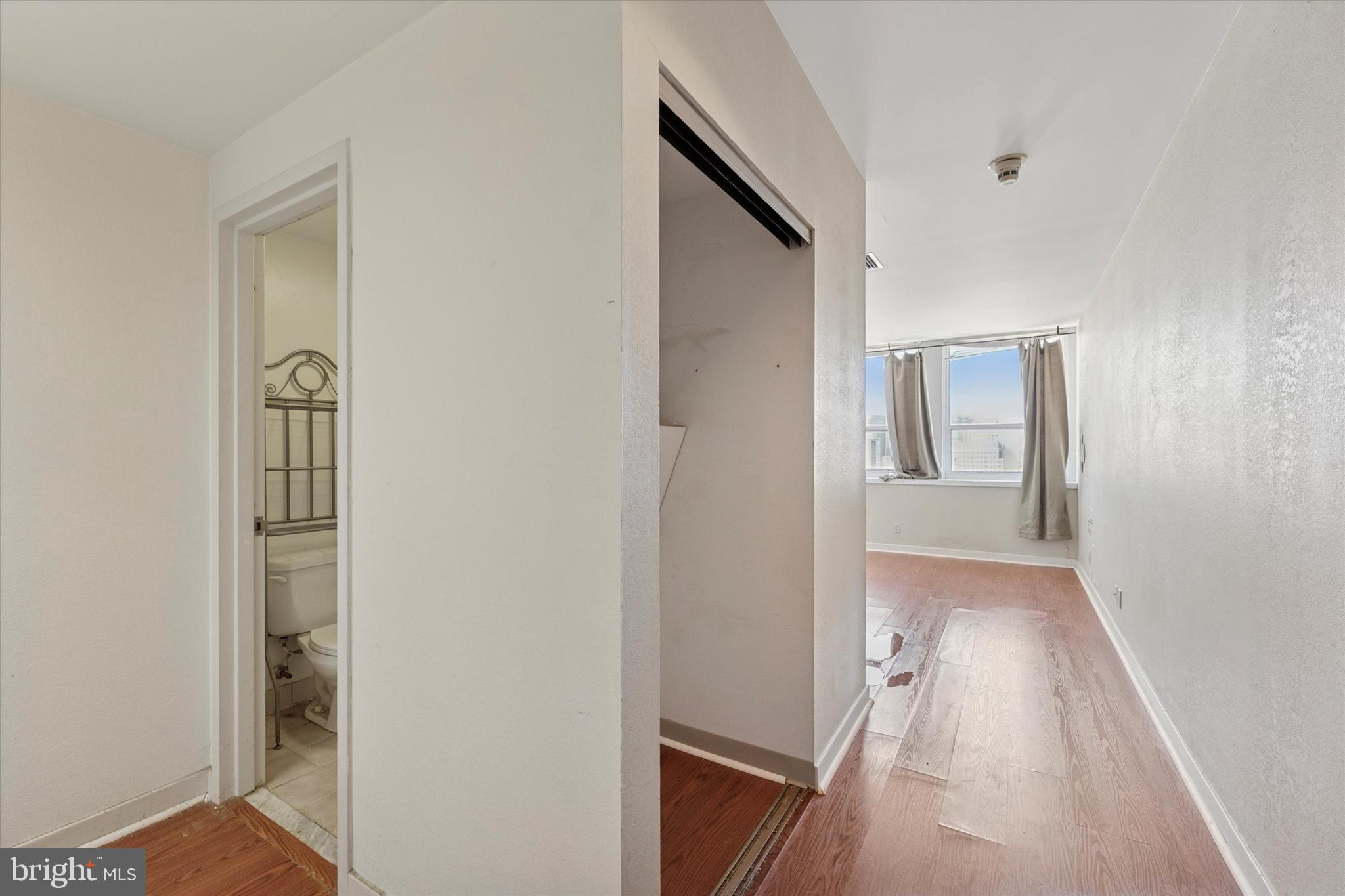 1100 Vine Street, Unit P211 Philadelphia, PA 19107 - Photo 13 of 20 a view of a hallway with wooden floor and closet