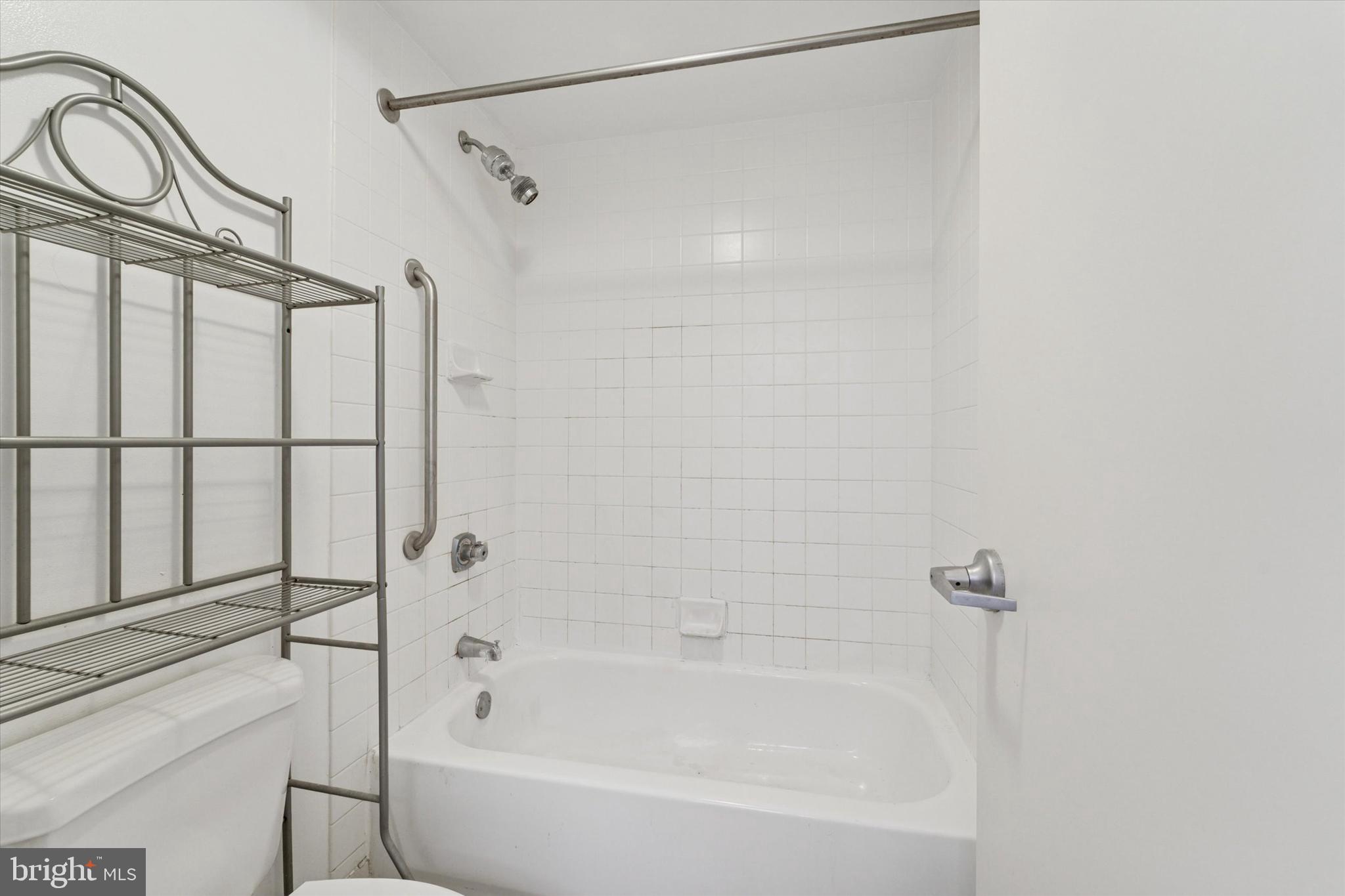 1100 Vine Street, Unit P211 Philadelphia, PA 19107 - Photo 15 of 20 a bathroom with a bathtub and a shower