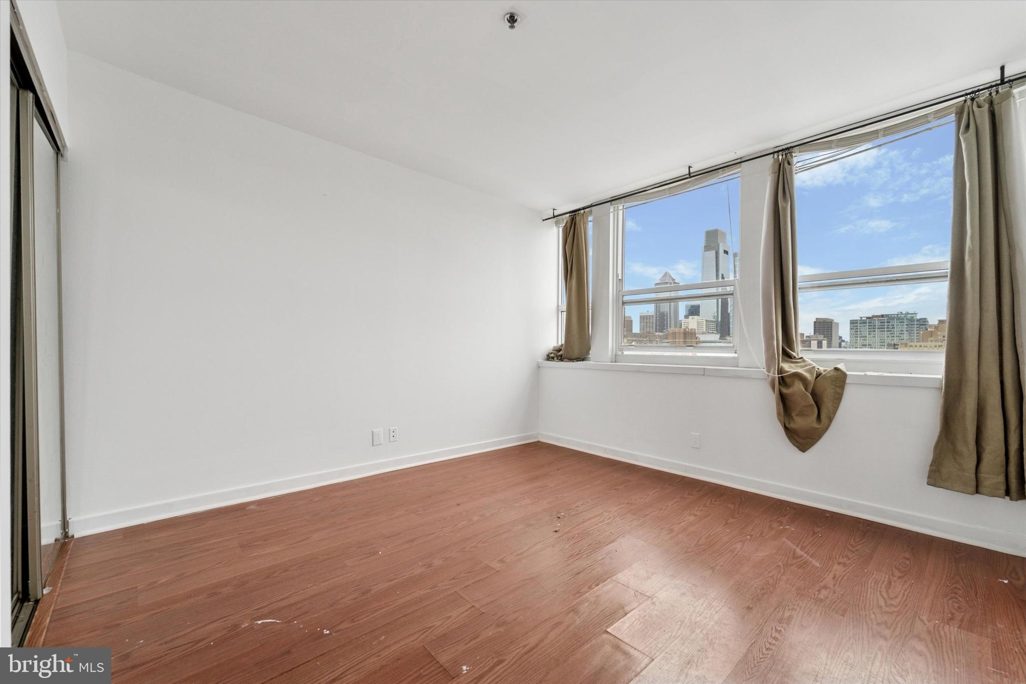 1100 Vine Street, Unit P211 Philadelphia, PA 19107 - Photo 18 of 20 an empty room with a window