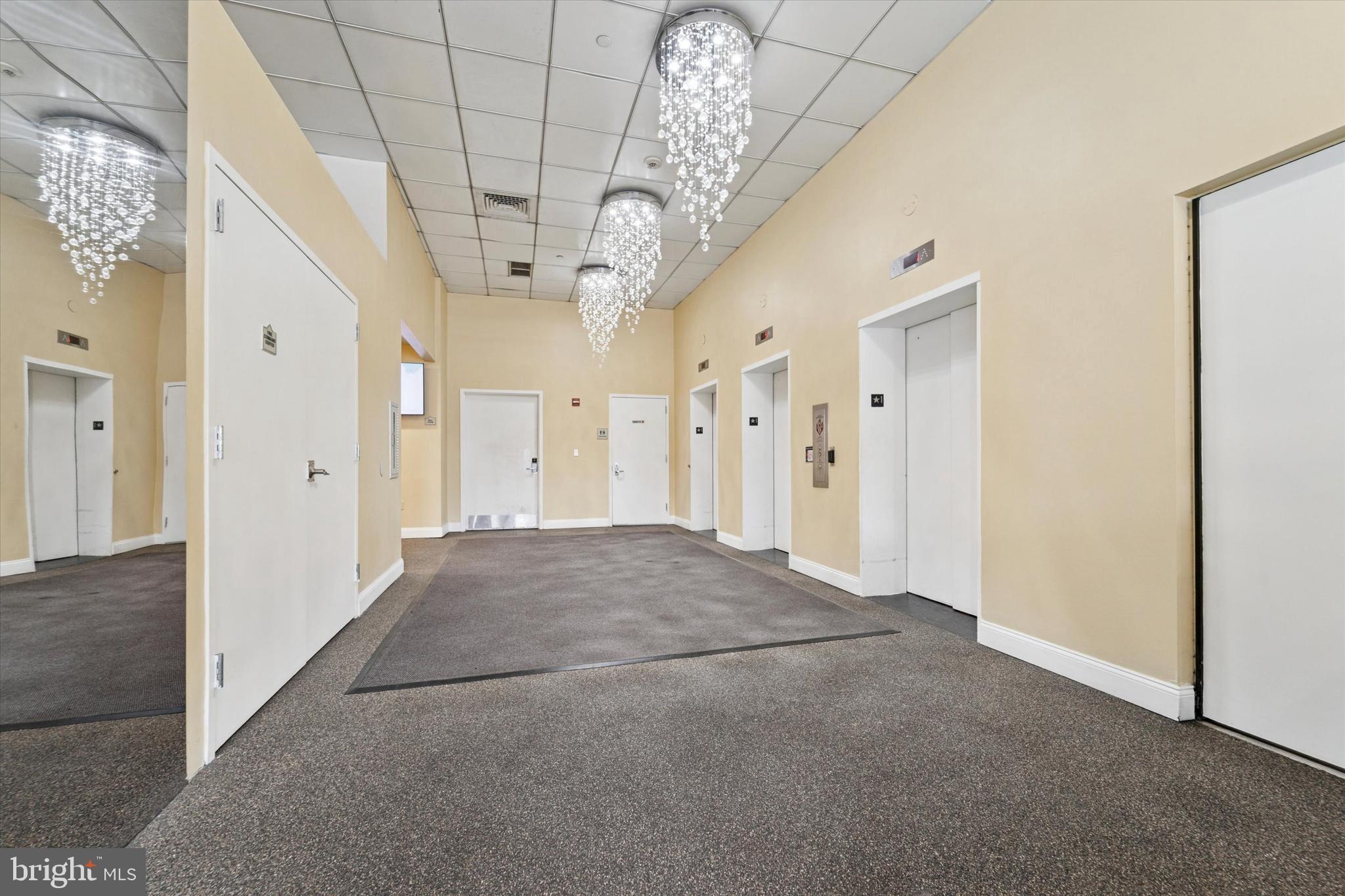 1100 Vine Street, Unit P211 Philadelphia, PA 19107 - Photo 4 of 20 a view of a hallway with a chandelier