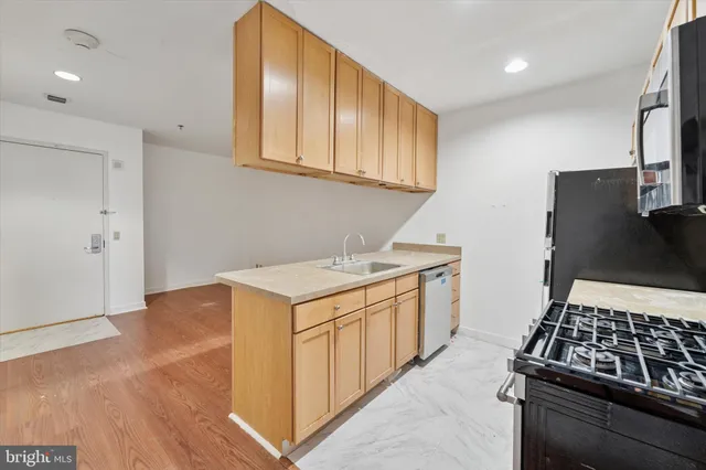 a kitchen with a stove and a refrigerator