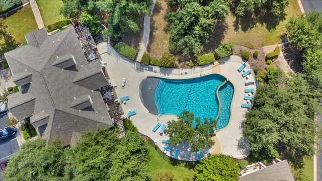 an aerial view of a house with a yard and garden