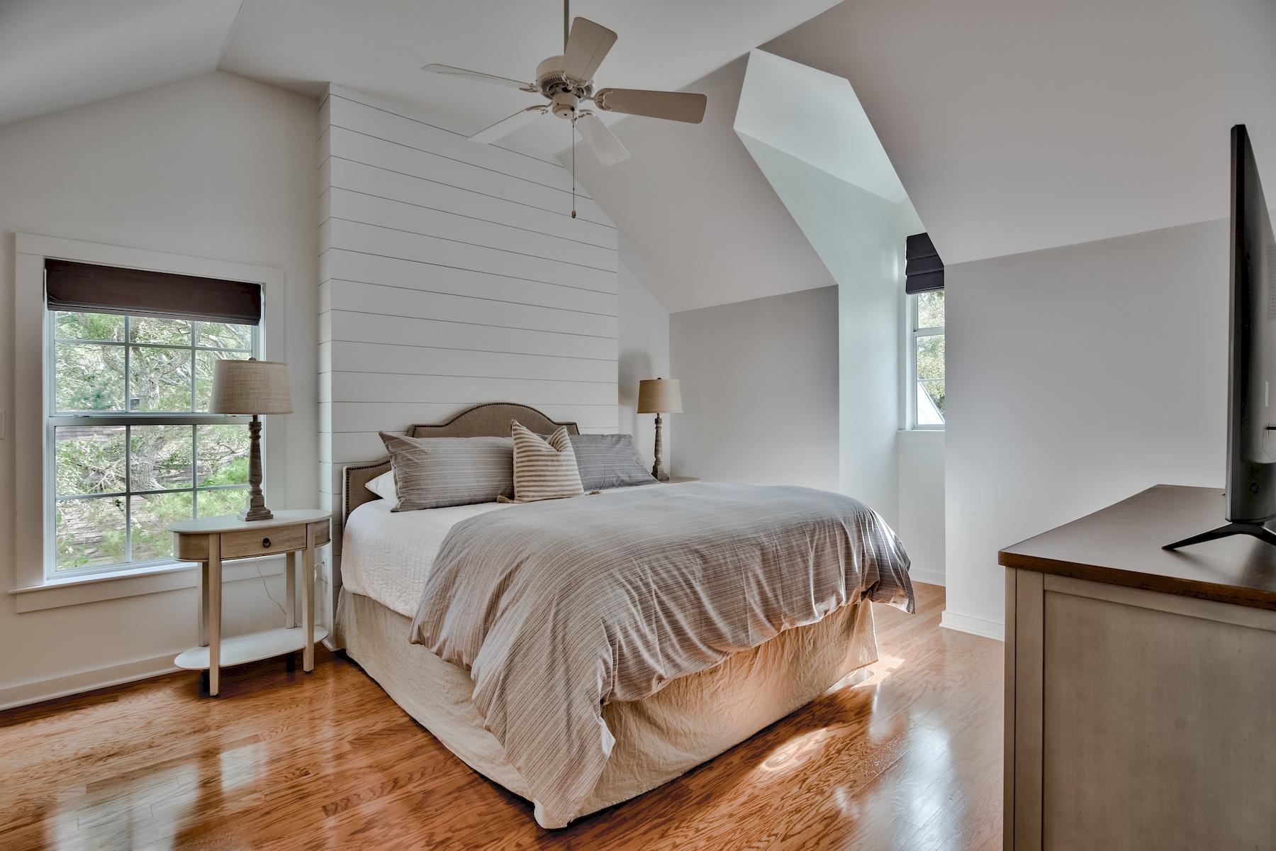 149 East Grove Avenue Santa Rosa Beach, FL 32459 - Photo 12 of 42 a spacious bedroom with two beds and a window