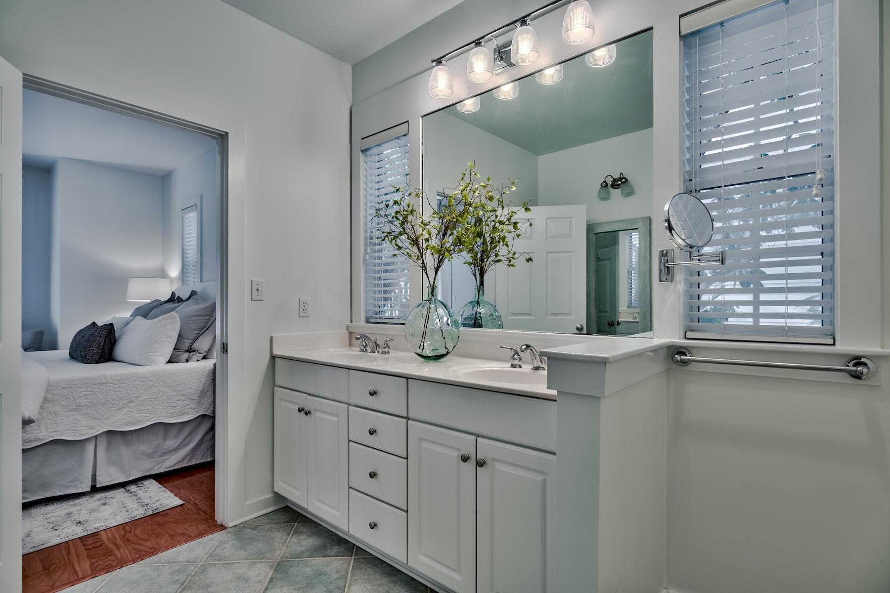 149 East Grove Avenue Santa Rosa Beach, FL 32459 - Photo 14 of 42 a en suite bathroom with a granite countertop sink and a mirror