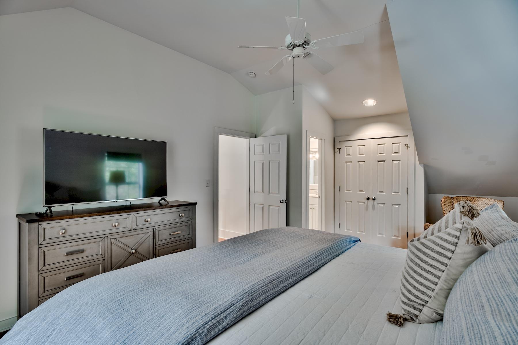 149 East Grove Avenue Santa Rosa Beach, FL 32459 - Photo 20 of 42 a bedroom with a bed and a flat screen tv