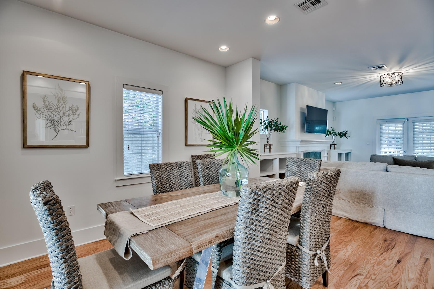149 East Grove Avenue Santa Rosa Beach, FL 32459 - Photo 2 of 42 a living room with furniture a chandelier and a dining room