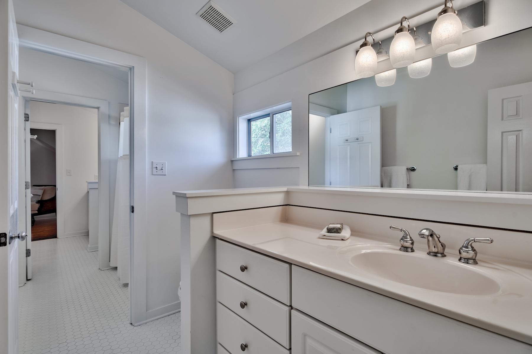 149 East Grove Avenue Santa Rosa Beach, FL 32459 - Photo 21 of 42 a bathroom with a sink and a mirror