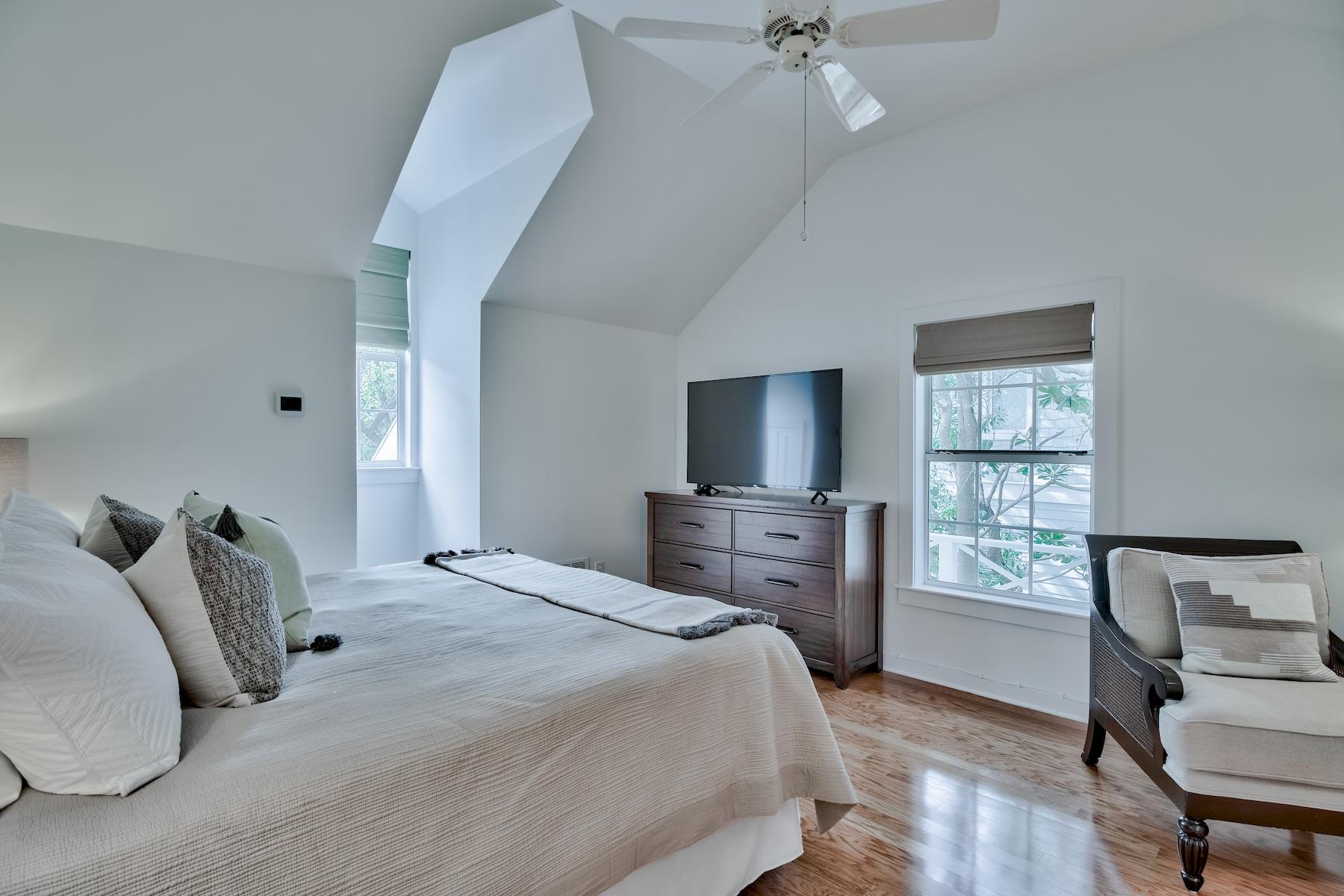 149 East Grove Avenue Santa Rosa Beach, FL 32459 - Photo 22 of 42 a bedroom with a bed and a flat screen tv