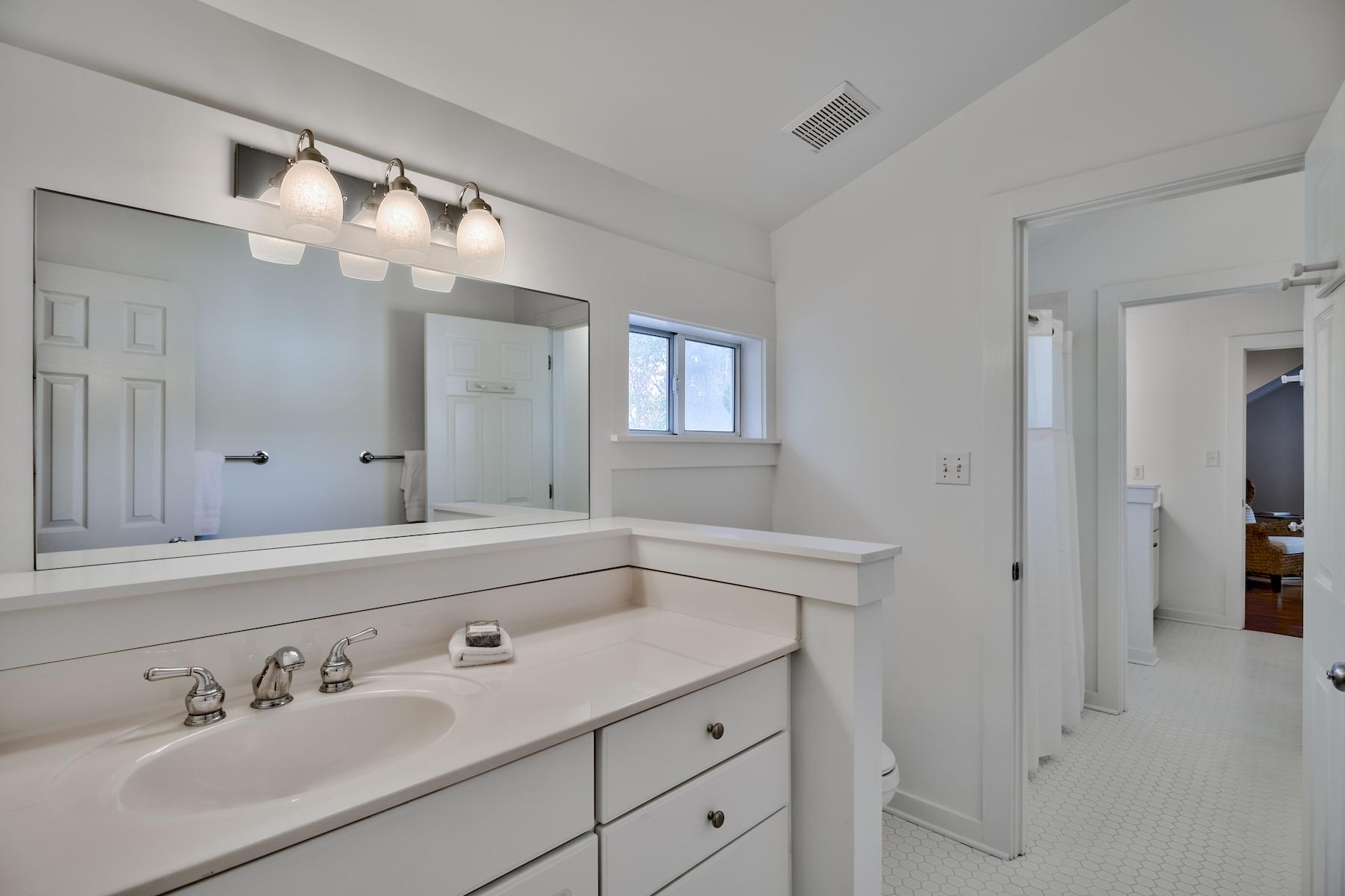 149 East Grove Avenue Santa Rosa Beach, FL 32459 - Photo 24 of 42 a bathroom with a sink vanity and mirror