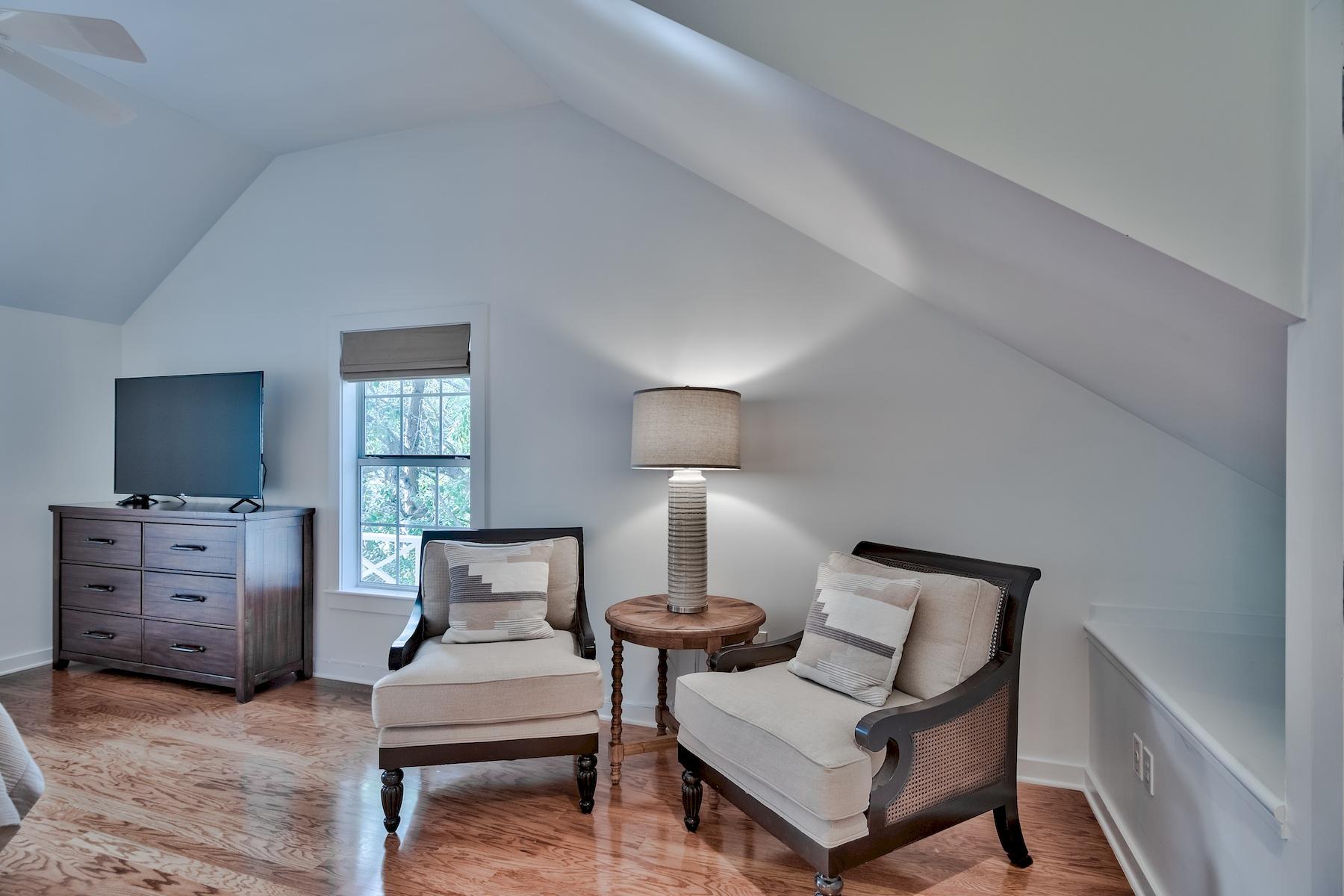 149 East Grove Avenue Santa Rosa Beach, FL 32459 - Photo 27 of 42 a bedroom with furniture and a lamp