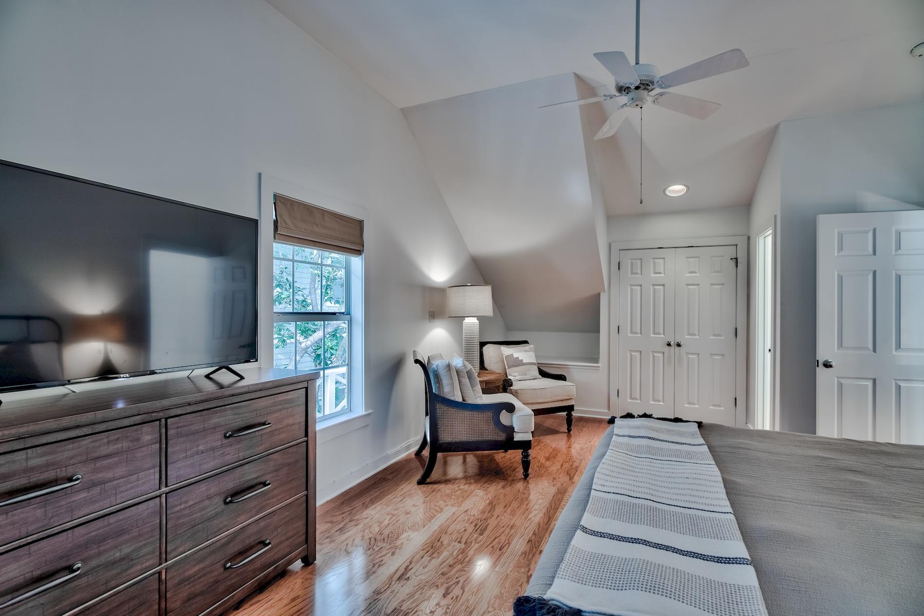 149 East Grove Avenue Santa Rosa Beach, FL 32459 - Photo 28 of 42 a large bedroom with a bed and a large mirror on a dresser