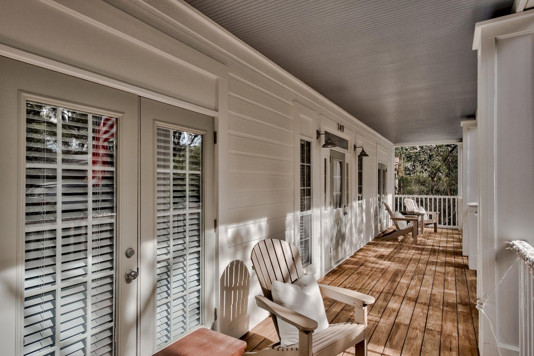 149 East Grove Avenue Santa Rosa Beach, FL 32459 - Photo 29 of 42 a balcony with chairs and table