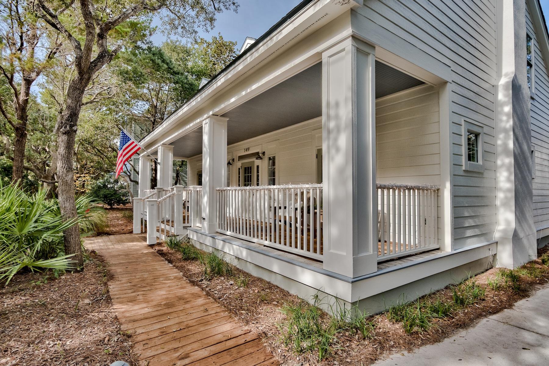 149 East Grove Avenue Santa Rosa Beach, FL 32459 - Photo 32 of 42 a view of a house with a yard and floor to ceiling window and wooden fence