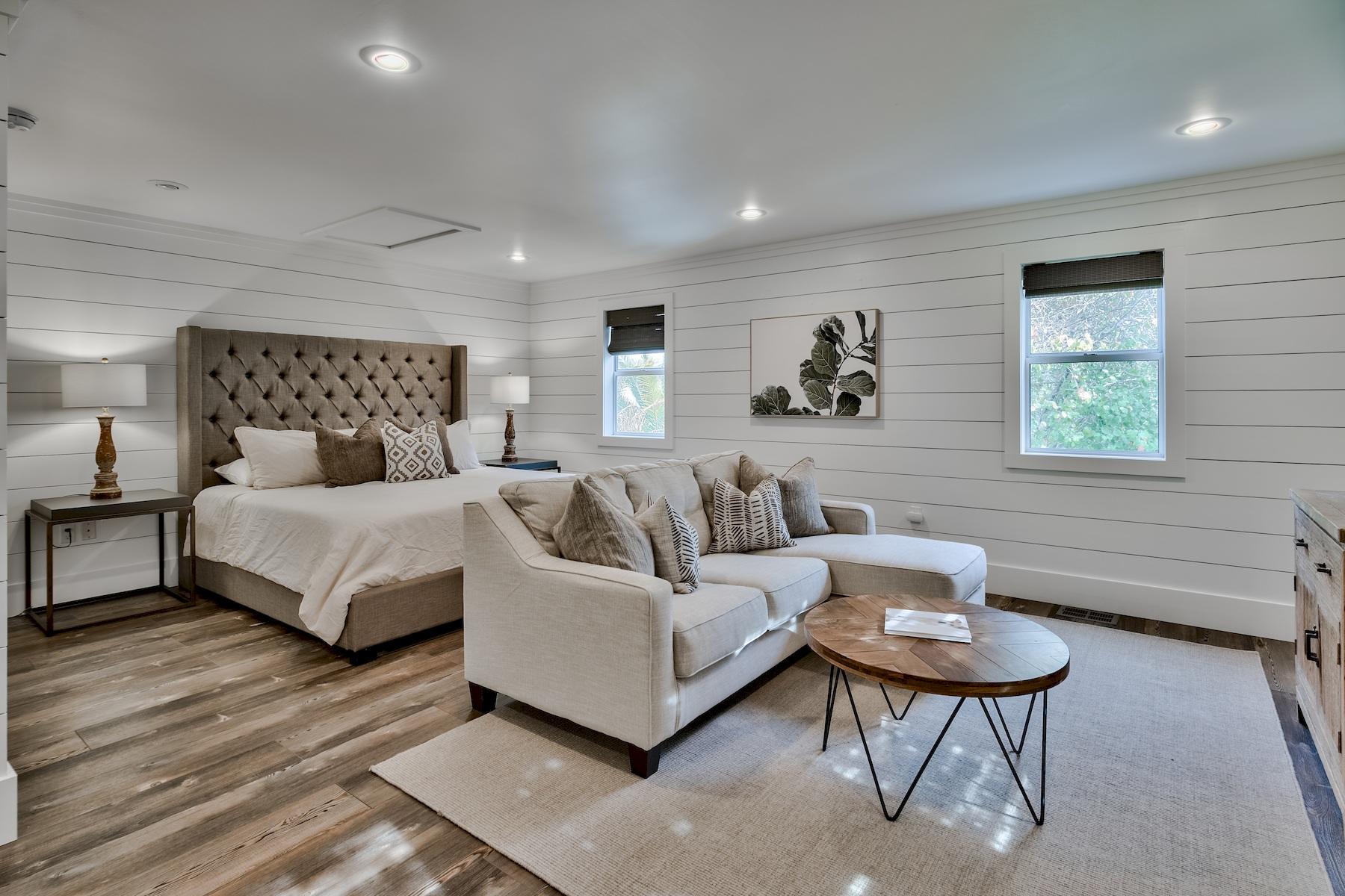 149 East Grove Avenue Santa Rosa Beach, FL 32459 - Photo 33 of 42 a spacious bedroom with a bed and a couch