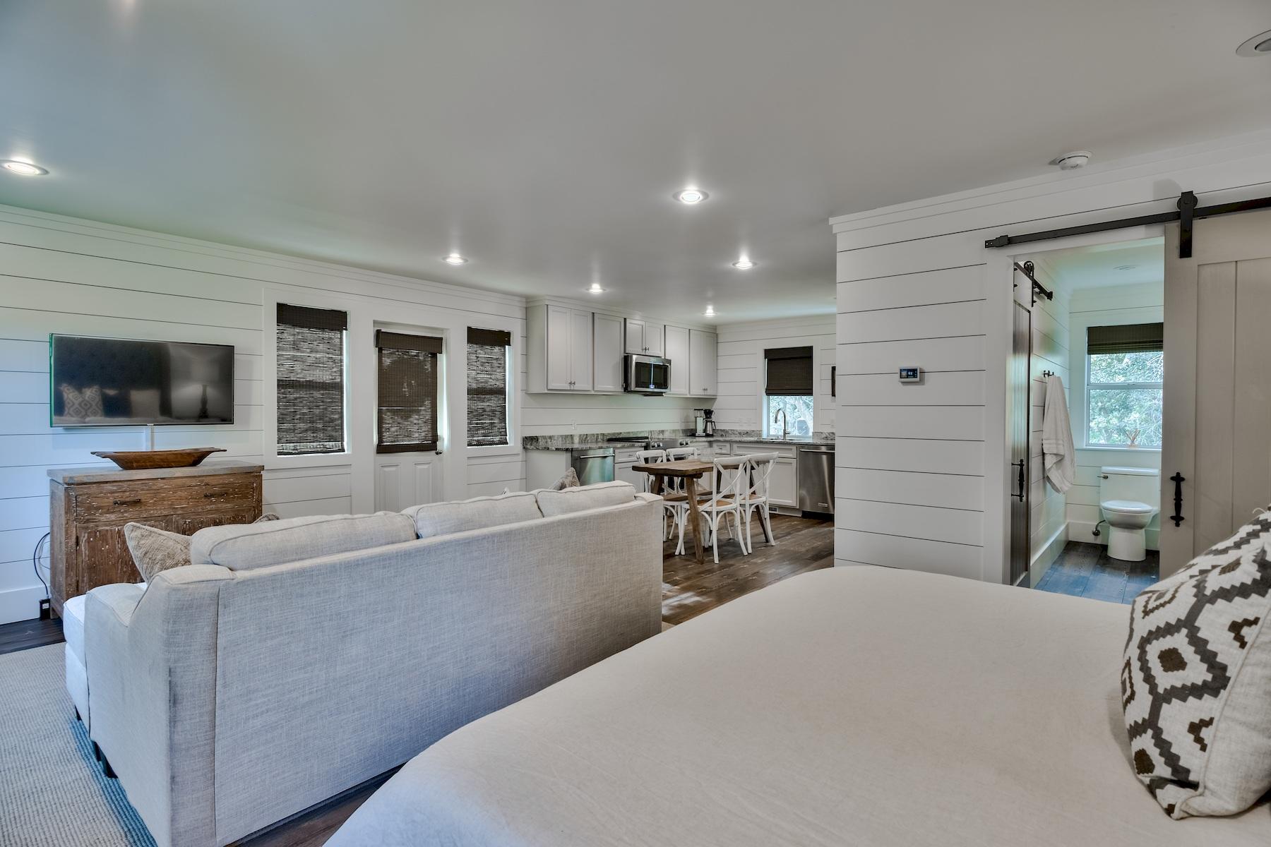 149 East Grove Avenue Santa Rosa Beach, FL 32459 - Photo 35 of 42 a living room with furniture and a flat screen tv