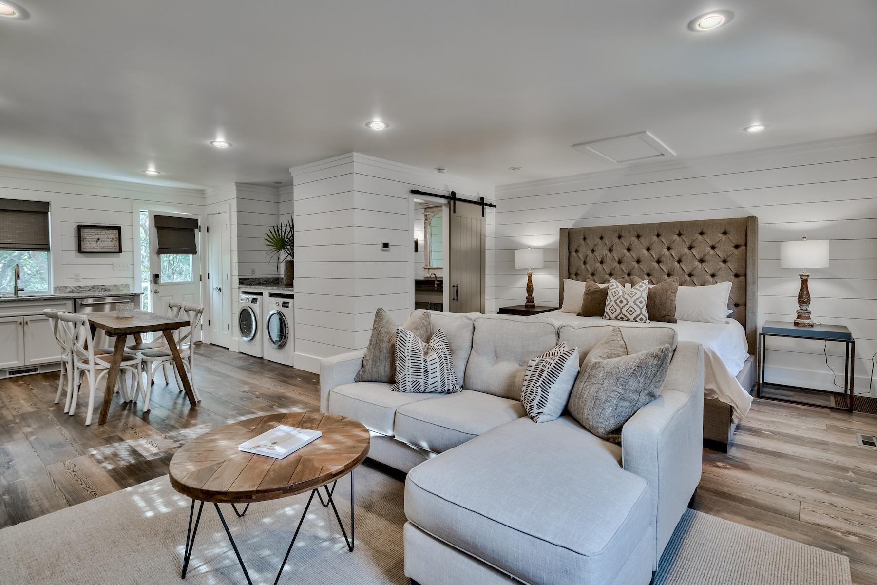 149 East Grove Avenue Santa Rosa Beach, FL 32459 - Photo 36 of 42 a living room with furniture and a wooden floor