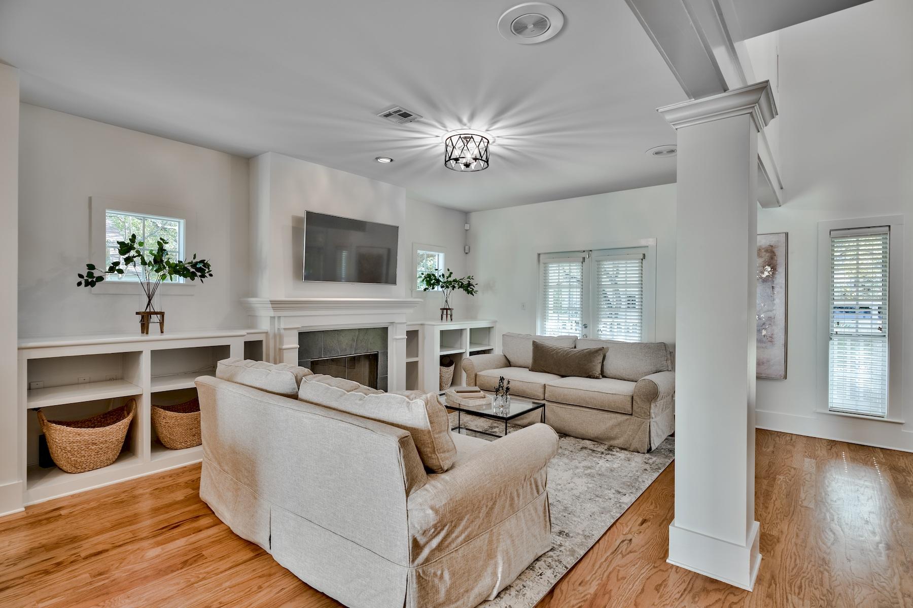 149 East Grove Avenue Santa Rosa Beach, FL 32459 - Photo 5 of 42 a living room with furniture a fireplace and a flat screen tv
