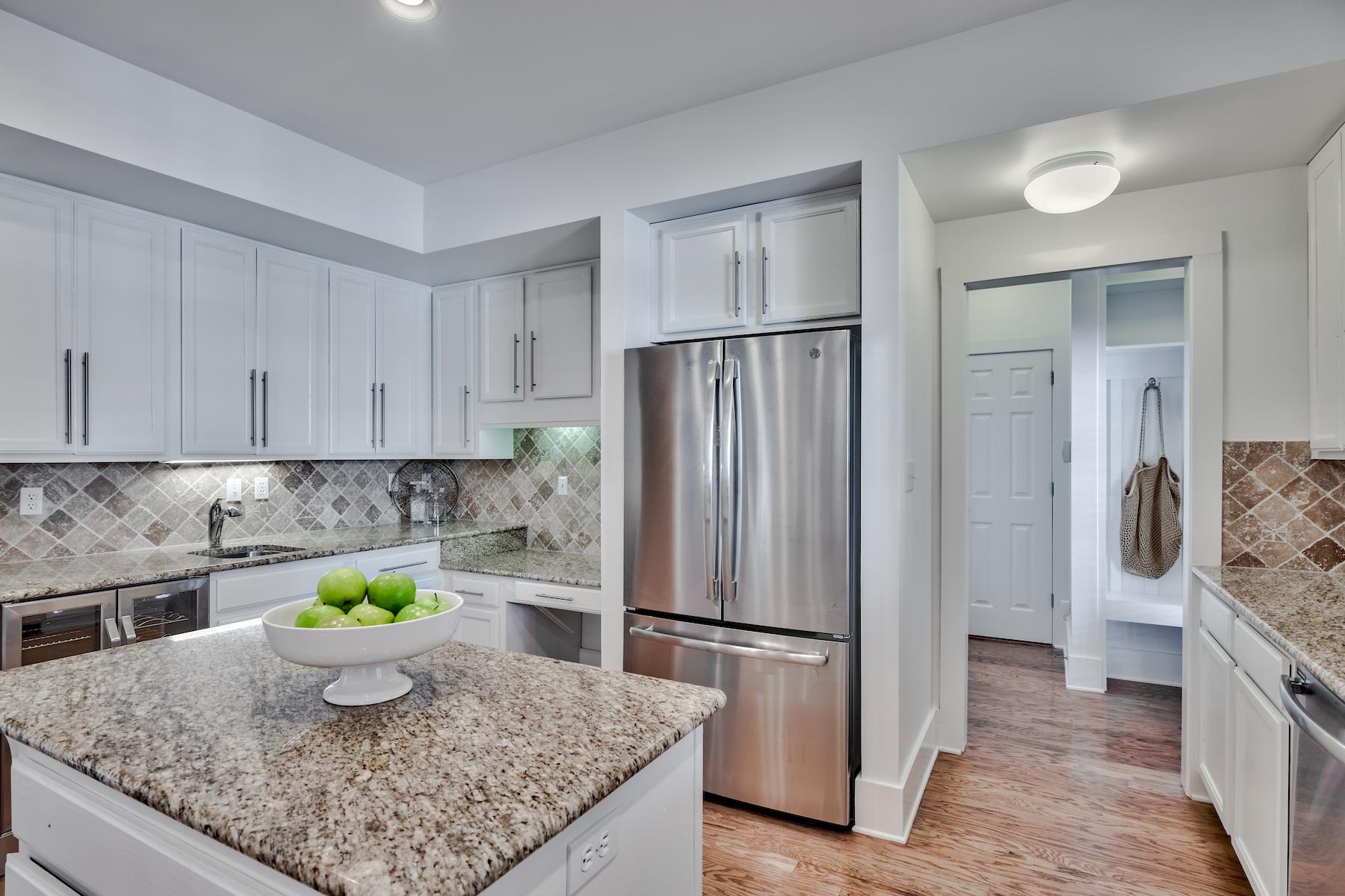 149 East Grove Avenue Santa Rosa Beach, FL 32459 - Photo 7 of 42 a kitchen with a refrigerator a stove a sink and a counter space