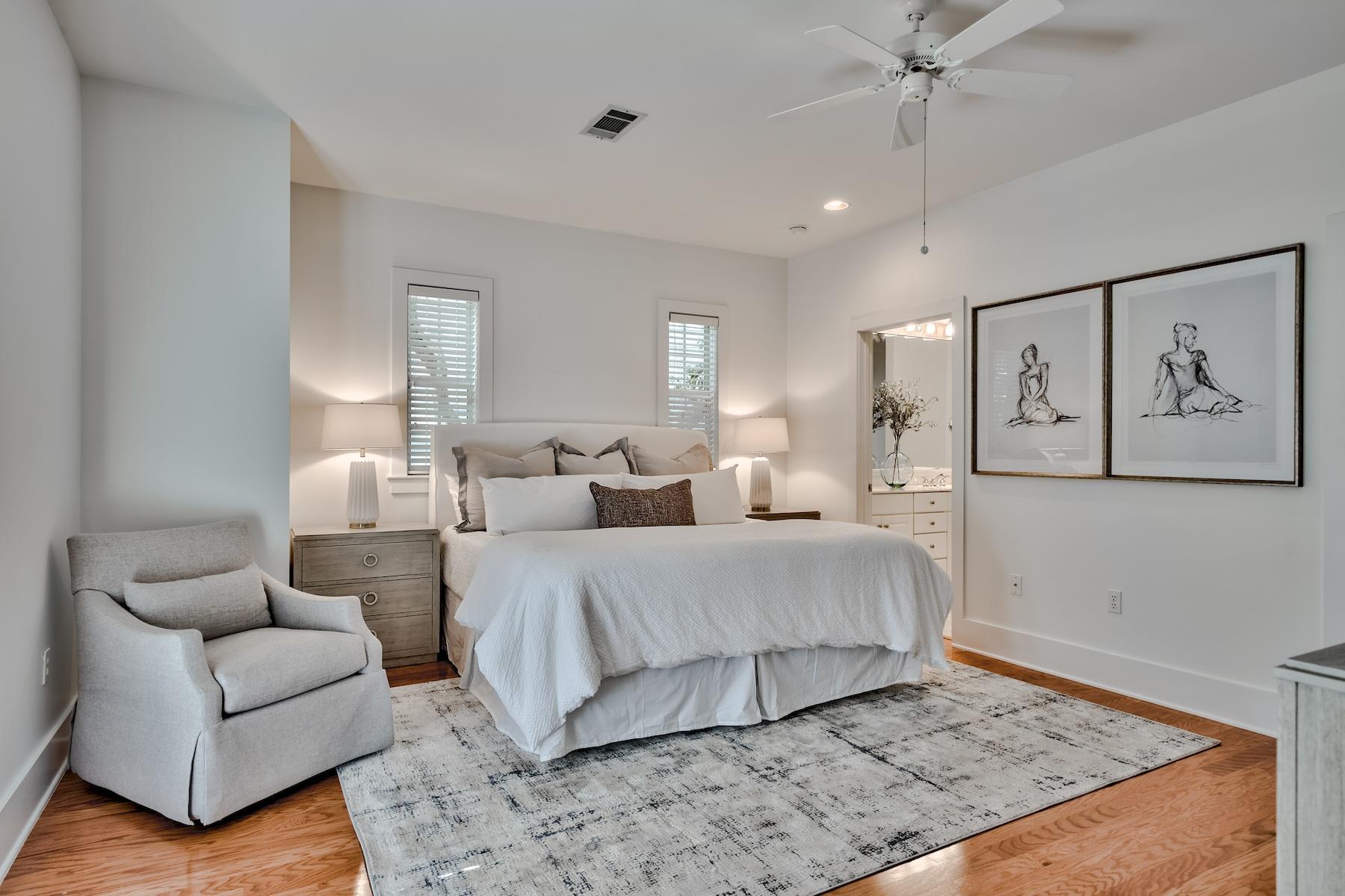149 East Grove Avenue Santa Rosa Beach, FL 32459 - Photo 10 of 42 a spacious bedroom with a bed a couch and painting on wall