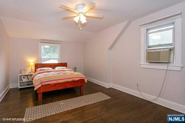24 Robinhood Avenue Closter, NJ 07624 - Photo 11 of 20 a bedroom with a bed and a window