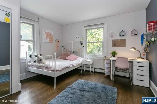 24 Robinhood Avenue Closter, NJ 07624 - Photo 12 of 20 a bedroom with a bed and a window