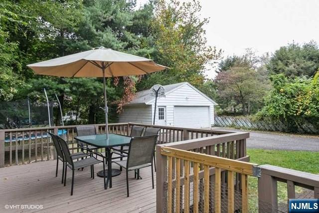 24 Robinhood Avenue Closter, NJ 07624 - Photo 18 of 20 a view of backyard with deck and outdoor seating