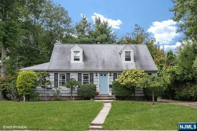 24 Robinhood Avenue Closter, NJ 07624 - Photo 20 of 20 a aerial view of a house next to a big yard and large trees