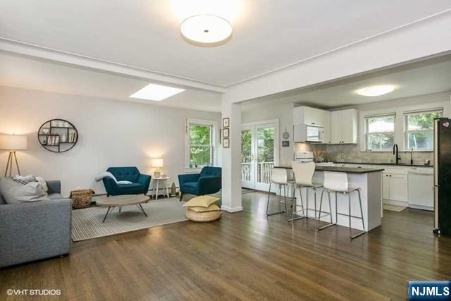 24 Robinhood Avenue Closter, NJ 07624 - Photo 4 of 20 a living room with furniture and a large window