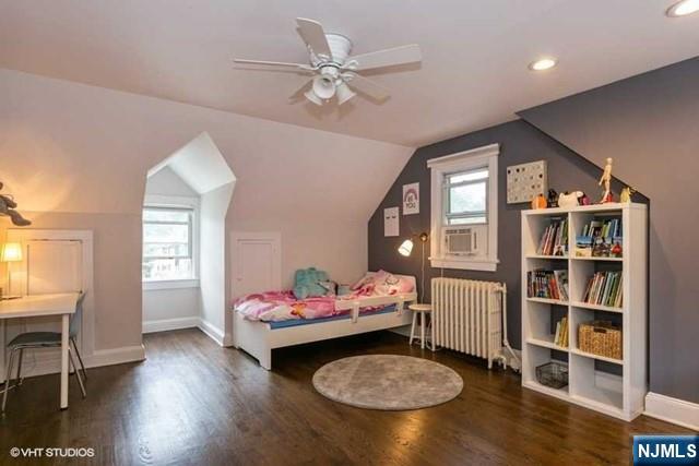 24 Robinhood Avenue Closter, NJ 07624 - Photo 10 of 20 a living room with furniture and a book shelf