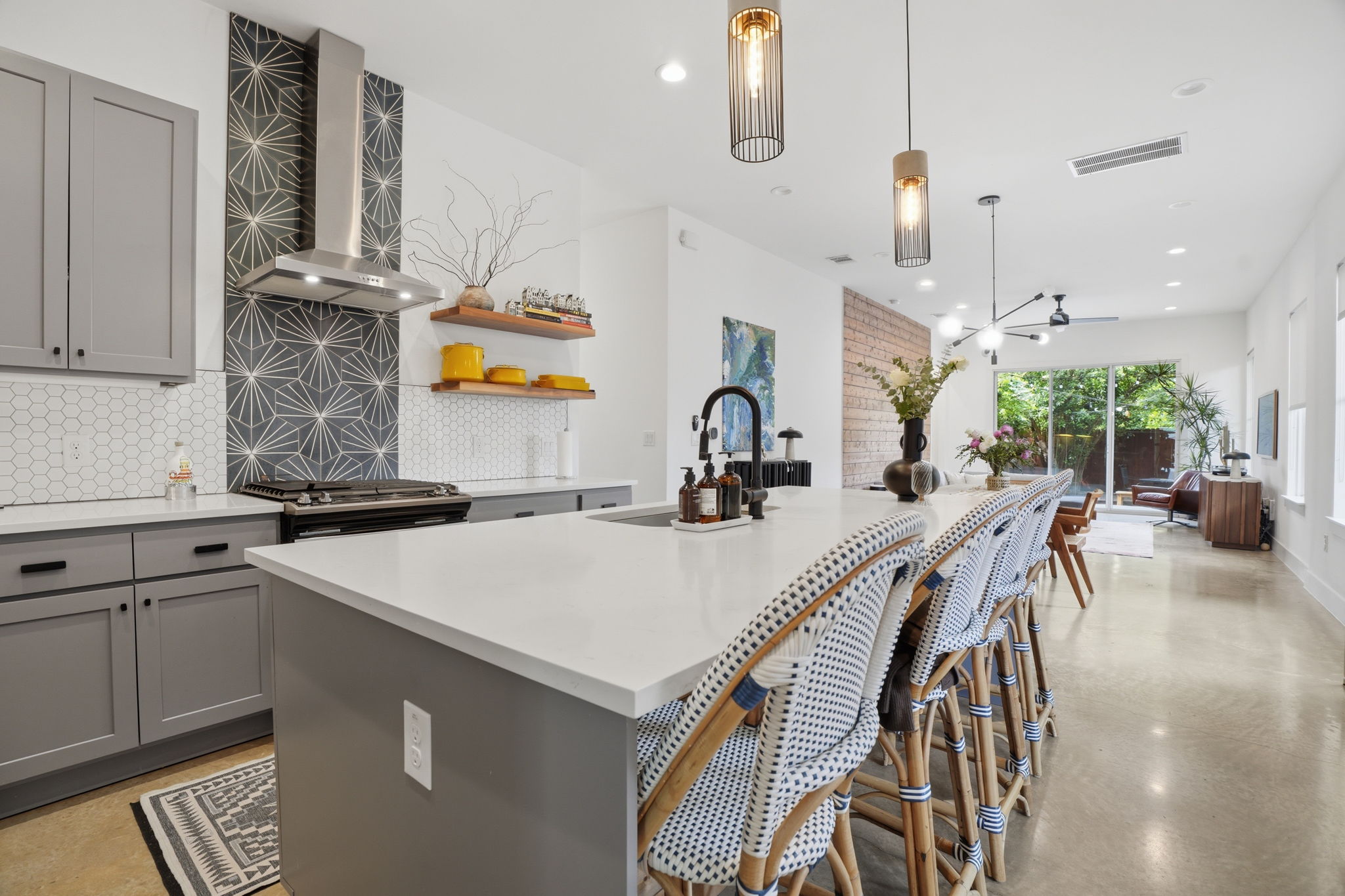 4609 Sara Drive, Unit B Austin, TX 78721 - Photo 11 of 39 Modern, open-concept kitchen, featuring shaker cabinetry, sleek countertops, SS appliances and a spacious island for entertaining.