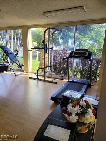 a view of a house with a yard and garden